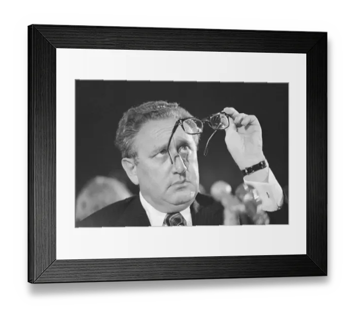 Framed Print : Henry Kissinger Looking at Glasses