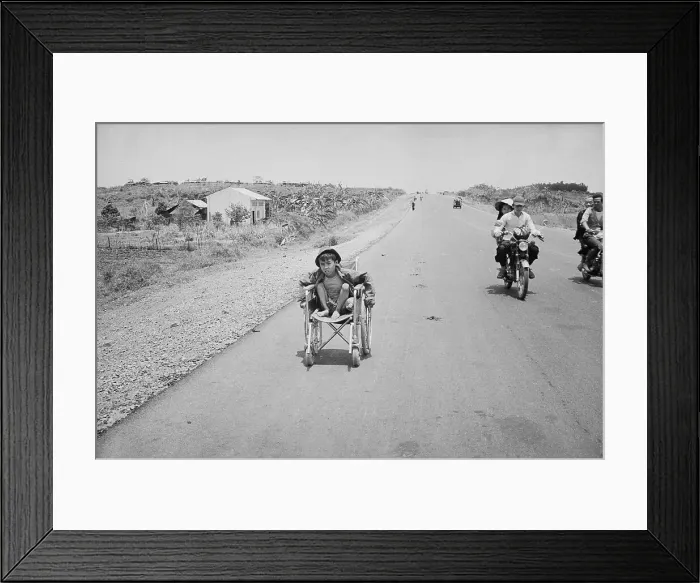 Framed Print : Disabled Boy Traveling Along Highway Framed Print : Disabled Boy Traveling Along Highway