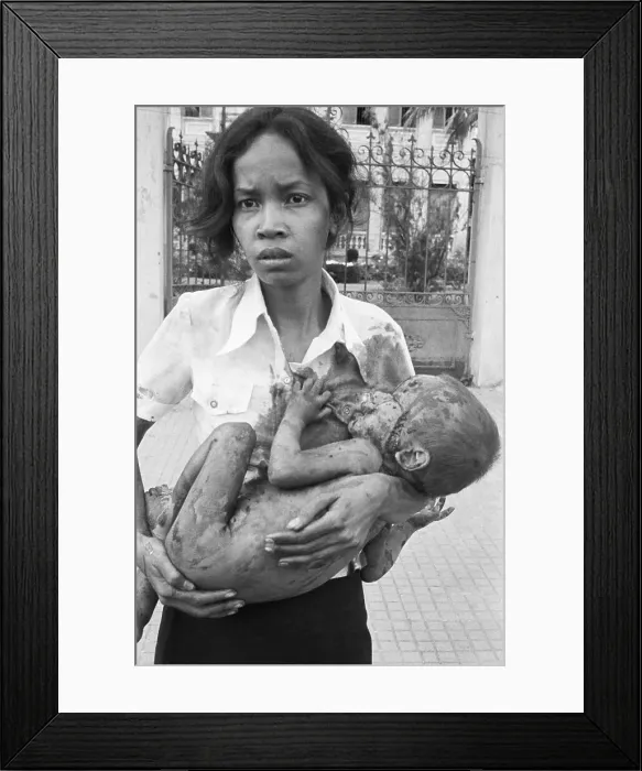 Framed Print : Woman Holds Her Wounded Child Framed Print : Woman Holds Her Wounded Child