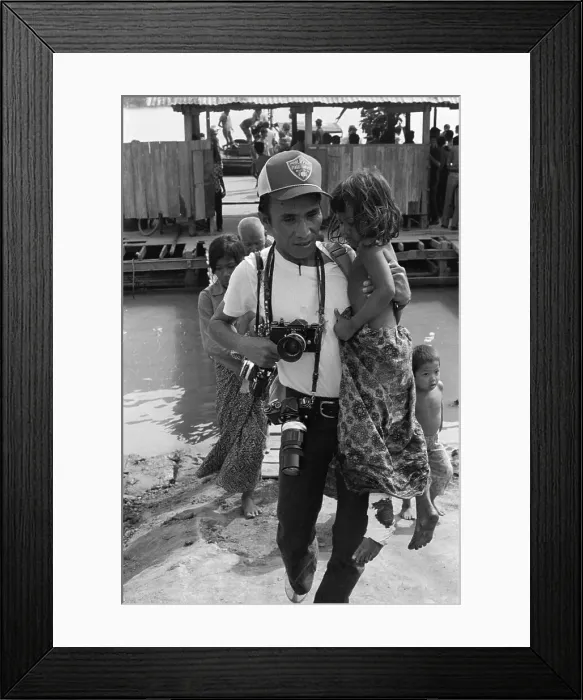 Framed Print : Willy Vicoy Carrying Cambodian Girl Framed Print : Willy Vicoy Carrying Cambodian Girl