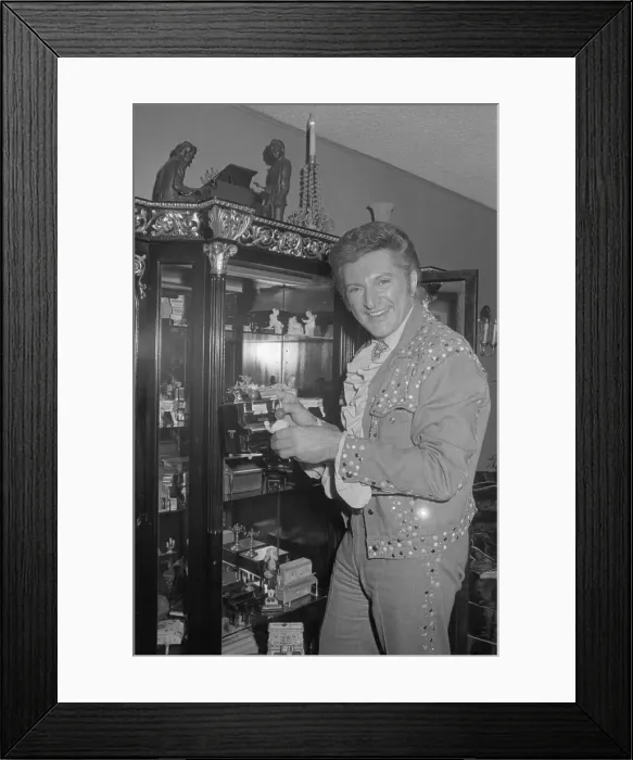 Framed Print : Liberace. Famous pianist Liberace (L) listens as one of his young proteges Framed Print : Liberace. Famous pianist Liberace (L) listens as one of his young proteges