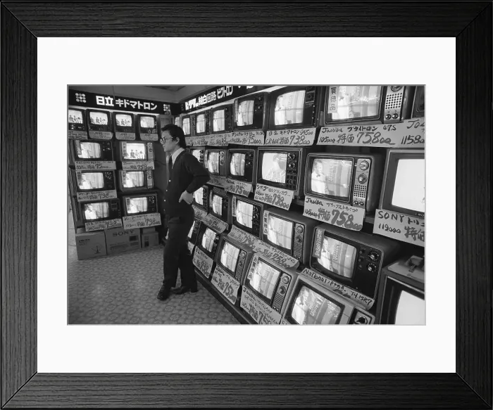 Framed Print : Salesman Stands Idly In Front Of Tv Sets Framed Print : Salesman Stands Idly In Front Of Tv Sets