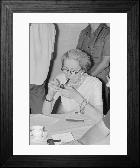 Framed Print : Millicent Fenwick Lighting a Pipe Framed Print : Millicent Fenwick Lighting a Pipe