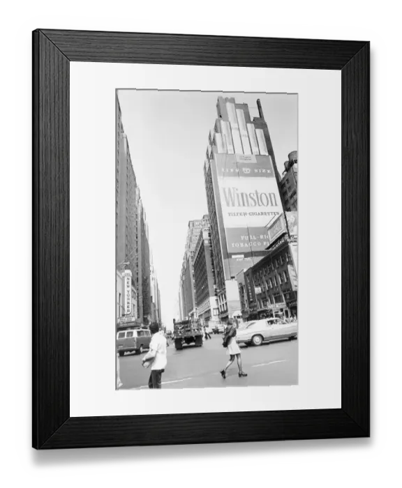 Framed Print : Pedestrians Crossing Street near Large Advertisement on Cigarettes Framed Print : Pedestrians Crossing Street near Large Advertisement on Cigarettes