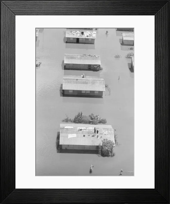 Framed Print : Aerial View Of Man On Roof In Flood Framed Print : Aerial View Of Man On Roof In Flood