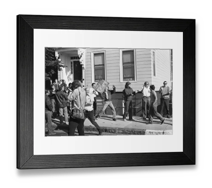 Framed Print : Young Demonstrator Heaves An Ash Can