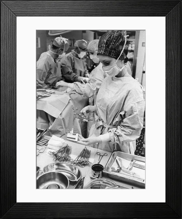 Framed Print : A Nurse Preparing Sutures Framed Print : A Nurse Preparing Sutures