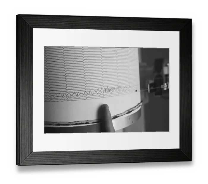 Framed Print : Finger Pointing to Earthquake Reading on Seismograph Framed Print : Finger Pointing to Earthquake Reading on Seismograph
