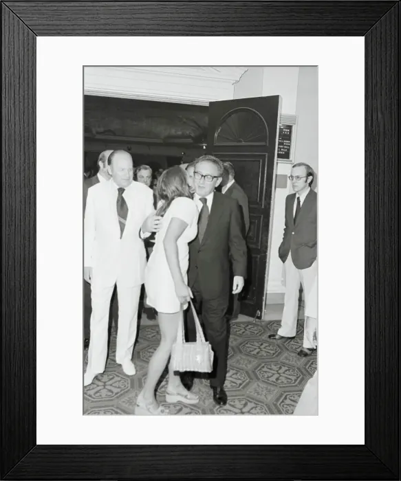 Framed Print : Henry Kissinger Receiving Kiss Framed Print : Henry Kissinger Receiving Kiss