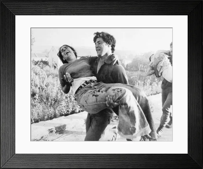 Framed Print : Young Man Carrying Injured Sister Framed Print : Young Man Carrying Injured Sister