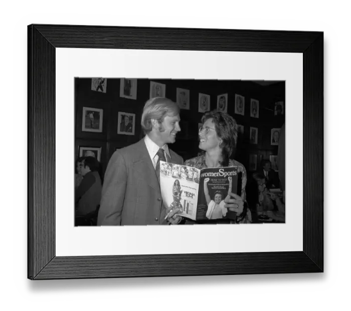 Framed Print : Billie Jean King and Husband Displaying Their New Magazine Framed Print : Billie Jean King and Husband Displaying Their New Magazine