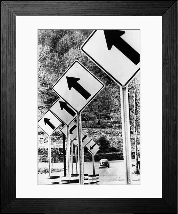 Framed Print : Car Driving By Up & Down Arrow Road Signs