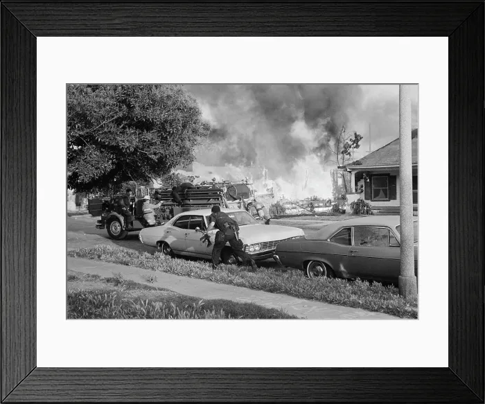 Framed Print : Police Officer Carrying a Machine Gun Framed Print : Police Officer Carrying a Machine Gun