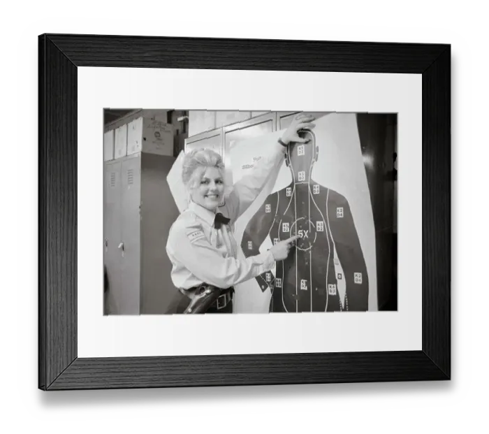 Framed Print : Policewoman Pointing out Target for Firearms Training Framed Print : Policewoman Pointing out Target for Firearms Training