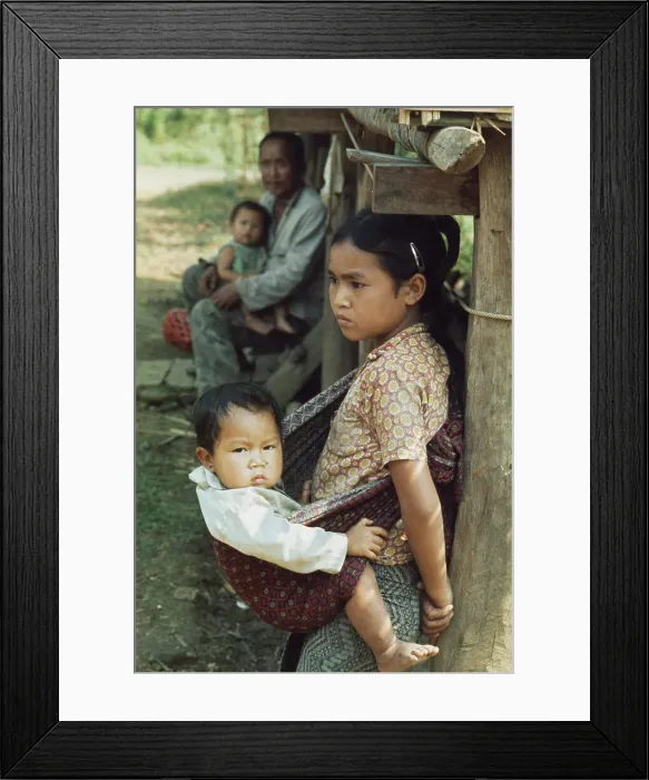 Framed Print : A Girl Carrying Her Baby Brother Framed Print : A Girl Carrying Her Baby Brother