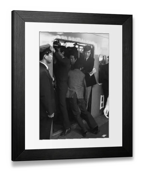 Framed Print : A Japanese Commuter Pushes Onto Train Framed Print : A Japanese Commuter Pushes Onto Train