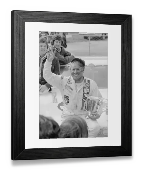 Framed Print : Racer Gale Yarborough Holding Trophy in Victory Pose Framed Print : Racer Gale Yarborough Holding Trophy in Victory Pose