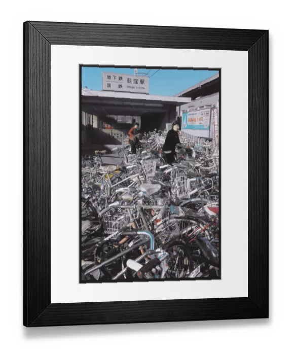 Framed Print : Woman Looking to Park Her Bike Framed Print : Woman Looking to Park Her Bike