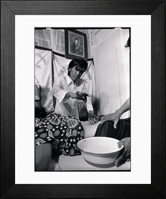 Framed Print : Alex Orbito is Shown Treating a Patient Framed Print : Alex Orbito is Shown Treating a Patient