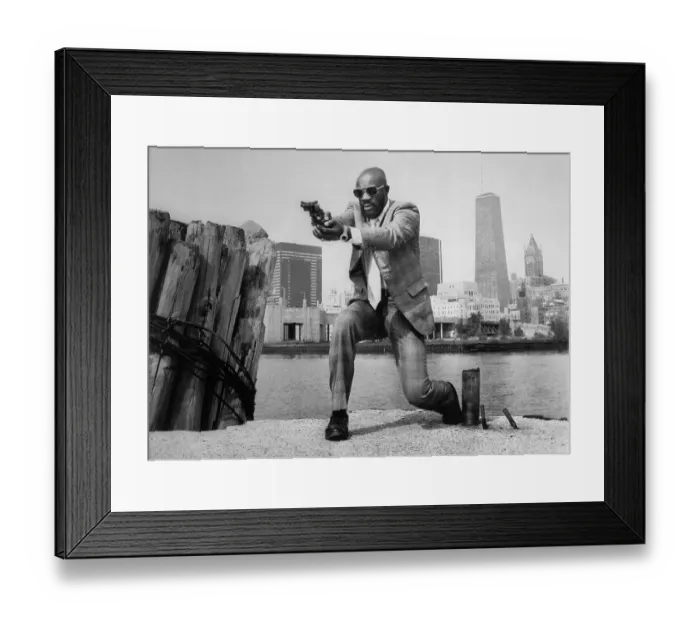 Framed Print : Isaac Hayes in Shooting Position in Movie Scene Framed Print : Isaac Hayes in Shooting Position in Movie Scene