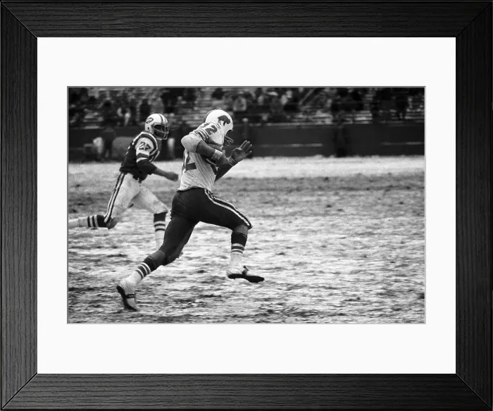 Framed Print : O.J. Simpson Flies Past the Jets Defense