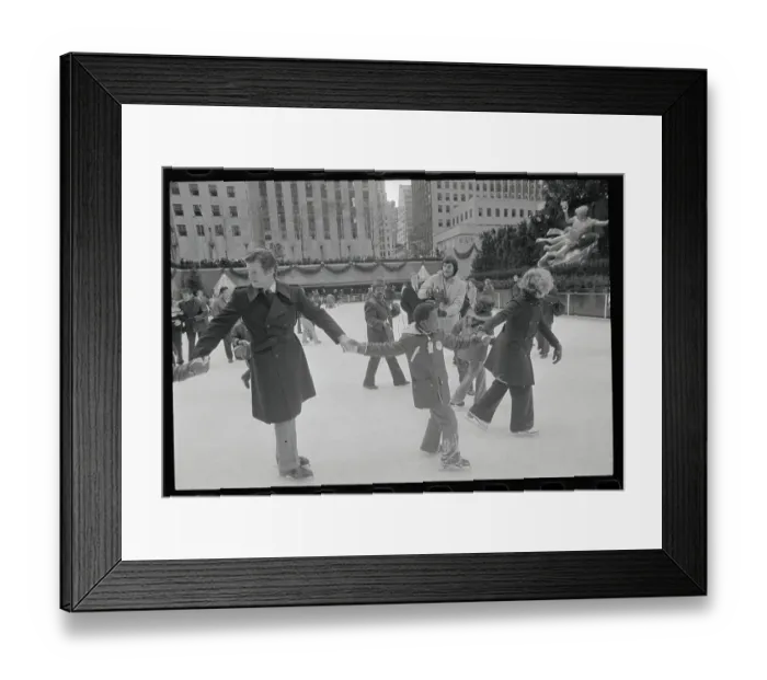 Framed Print : Edward M. Kennedy Helping a Child Skate Framed Print : Edward M. Kennedy Helping a Child Skate