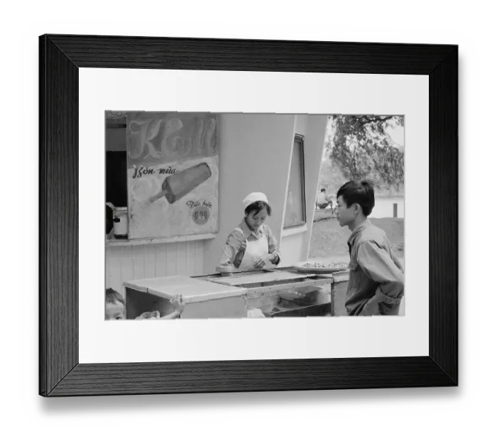 Framed Print : Vietnamese Woman Selling Ice Cream to Young Man Framed Print : Vietnamese Woman Selling Ice Cream to Young Man