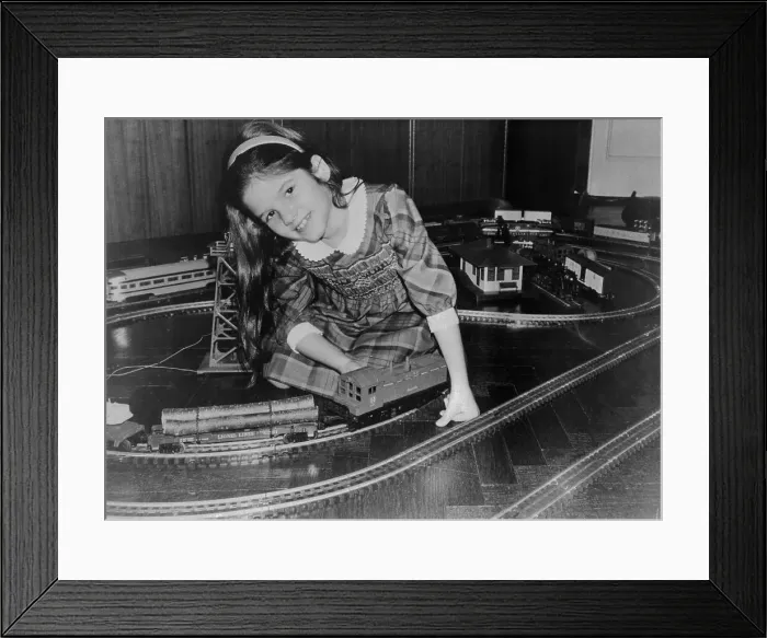 Framed Print : Girl Playing with Toy Trains Framed Print : Girl Playing with Toy Trains