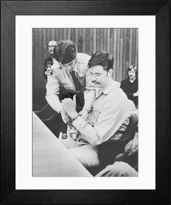 Framed Print : Officer Removing Manacles From Edmund Kemper's Wrists Framed Print : Officer Removing Manacles From Edmund Kemper's Wrists
