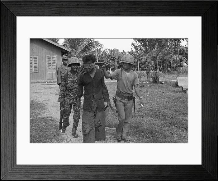 Framed Print : Blindfolded Suspect with Gun to Head