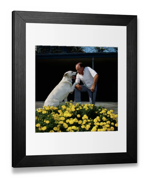 Framed Print : Bob Hope Playing with His Dog