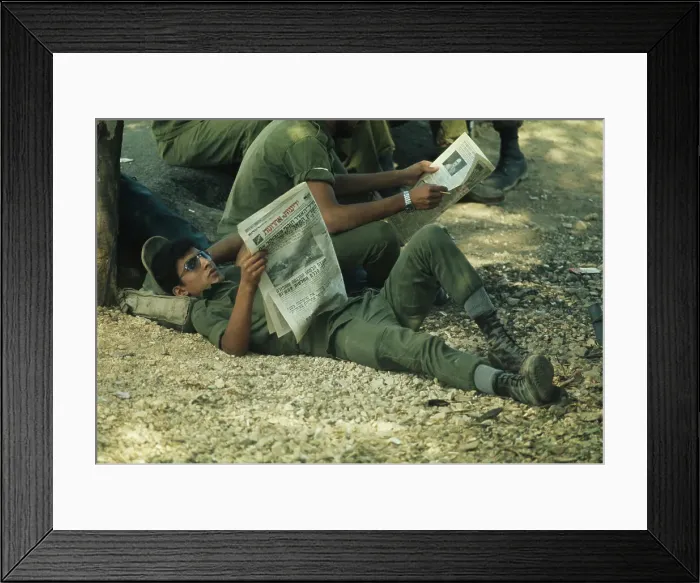 Framed Print : Israeli Soldier Reading Newspaper Framed Print : Israeli Soldier Reading Newspaper