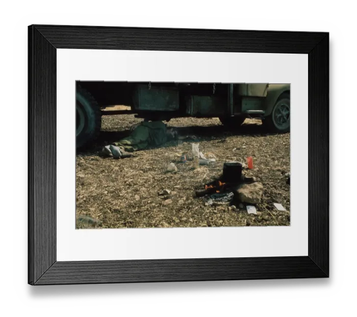 Framed Print : A Soldier Naps Under Truck