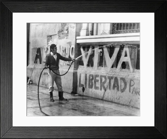 Framed Print : Student Hoses Down Viva Libertad Sign Framed Print : Student Hoses Down Viva Libertad Sign