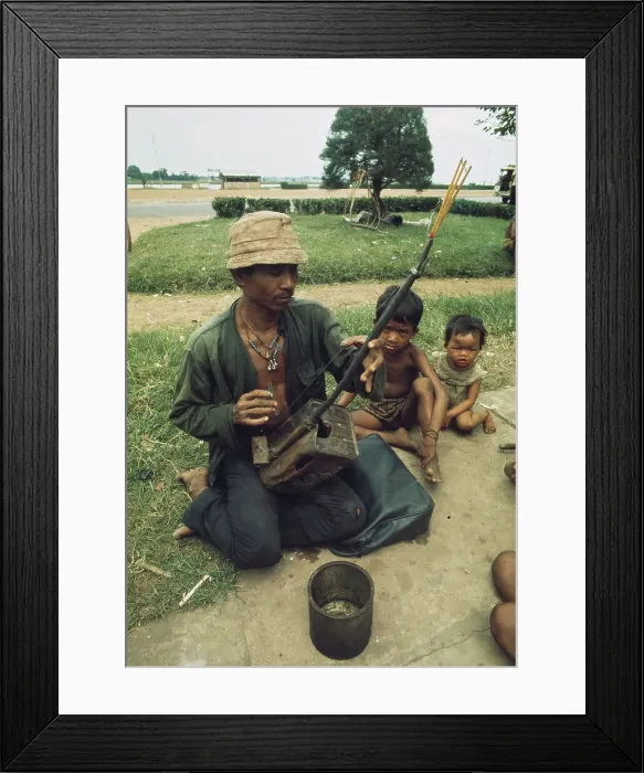 Framed Print : Man Playing Instrument In Phnom Penh Framed Print : Man Playing Instrument In Phnom Penh