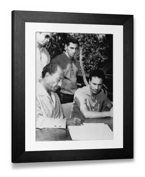 Framed Print : Anwar Sadat and Muammar al-Qaddafi