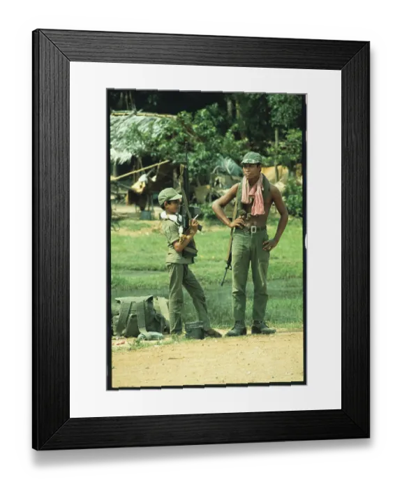 Framed Print : Young Cambodian Holding an M-16 Framed Print : Young Cambodian Holding an M-16