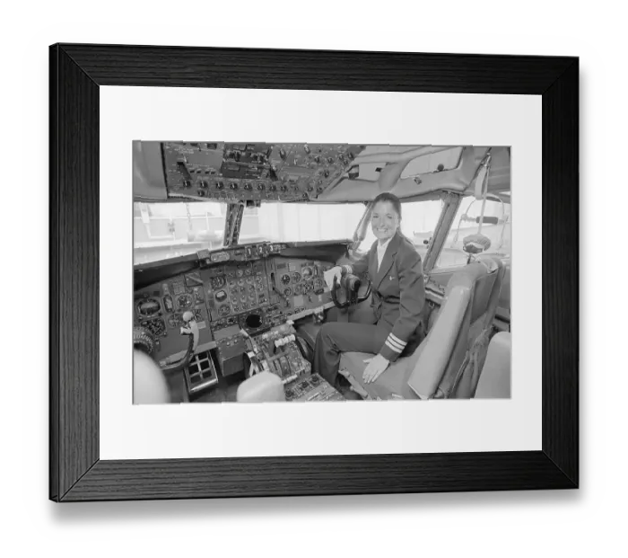 Framed Print : Female Pilot Sitting in Airplane Cockpit Framed Print : Female Pilot Sitting in Airplane Cockpit