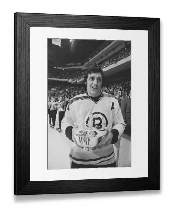 Framed Print : Phil Esposito Holding Trophy