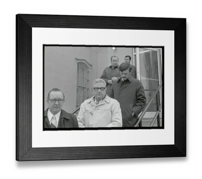 Framed Print : Security Men Escorting a Murder Suspect Framed Print : Security Men Escorting a Murder Suspect
