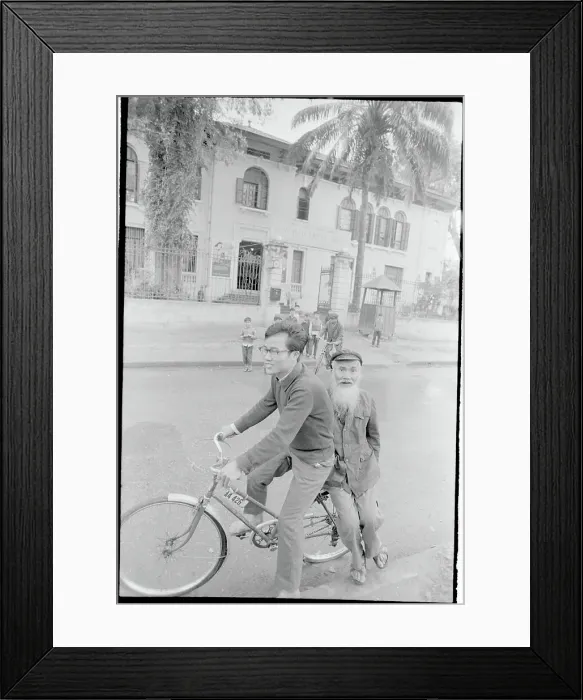 Framed Print : Child Transporting Grandfather on Bicycle Framed Print : Child Transporting Grandfather on Bicycle