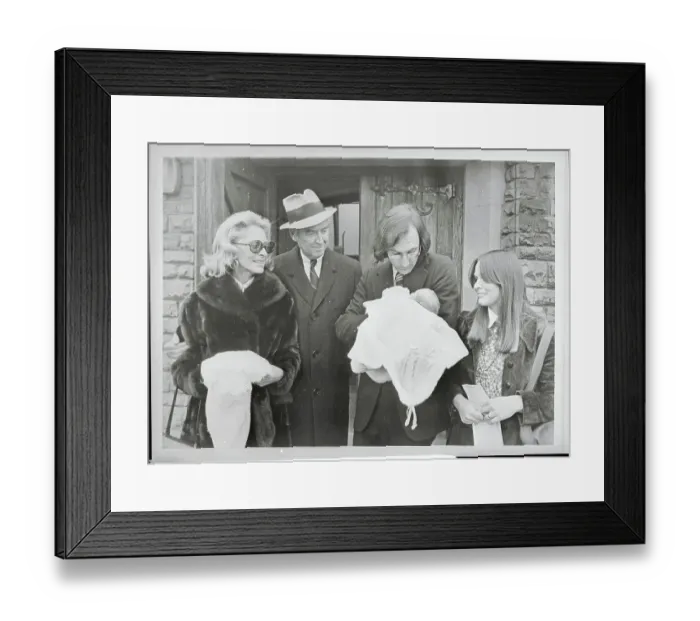 Framed Print : James and Gloria Stewart Looking at Their Grandson Framed Print : James and Gloria Stewart Looking at Their Grandson