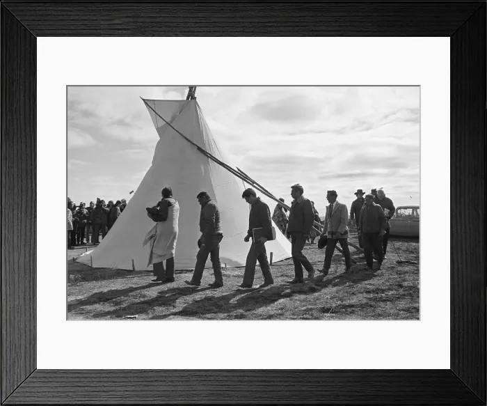 Framed Print : Line Of Men Walking Outside Teepee