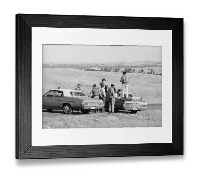 Framed Print : Group Surrounding Man Standing On Car Framed Print : Group Surrounding Man Standing On Car