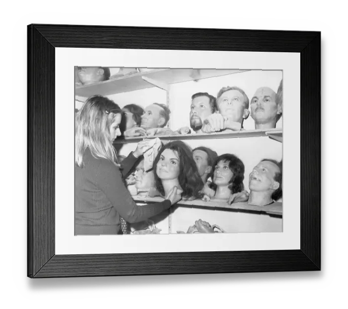 Framed Print : Woman Dusting Famous Heads in Waxworks Storage Framed Print : Woman Dusting Famous Heads in Waxworks Storage