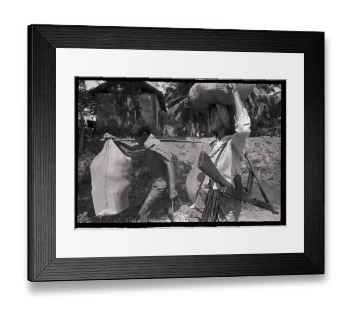 Framed Print : Vietnamese Family with Weapons of War Framed Print : Vietnamese Family with Weapons of War