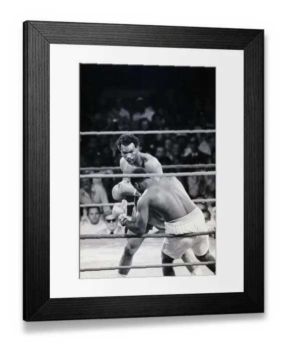 Framed Print : George Foreman Punching Joe Frazier Framed Print : George Foreman Punching Joe Frazier