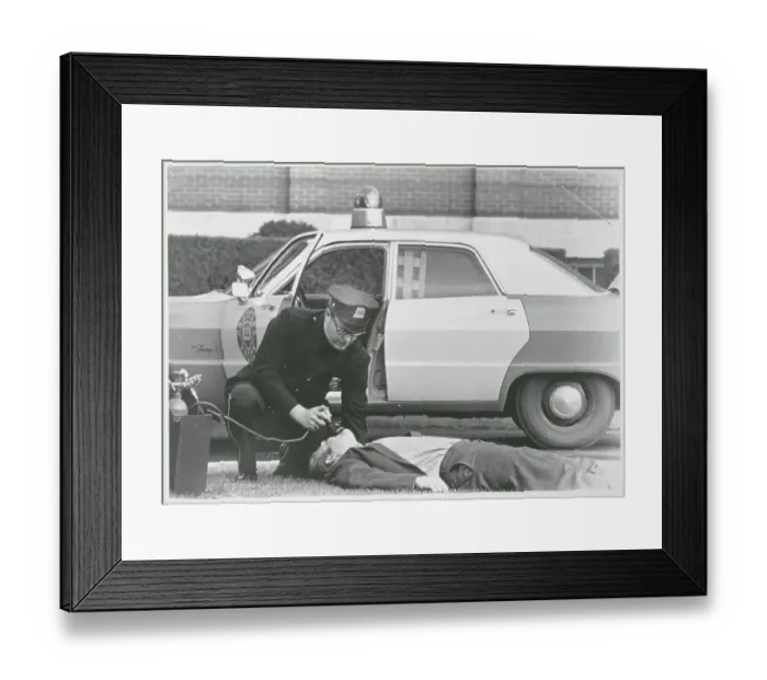 Framed Print : Policeman Reviving Heart Attack Victim Framed Print : Policeman Reviving Heart Attack Victim
