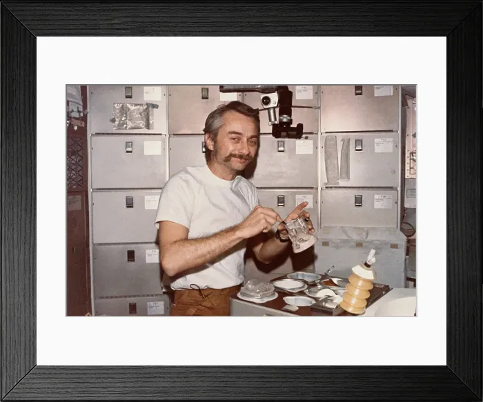 Framed Print : Owen Garriott Mixing His Food Framed Print : Owen Garriott Mixing His Food