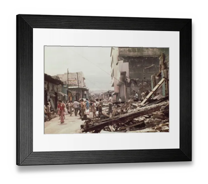 Framed Print : A man and his family carry possessions from their ruined home in Managua Framed Print : A man and his family carry possessions from their ruined home in Managua